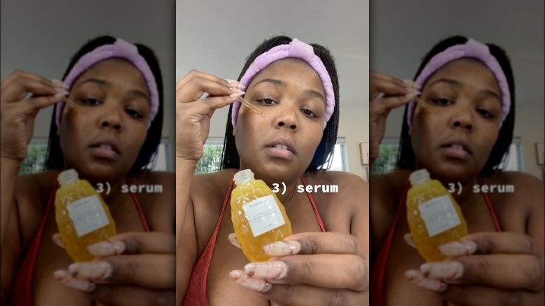 Lizzo using Glow Recipe serum