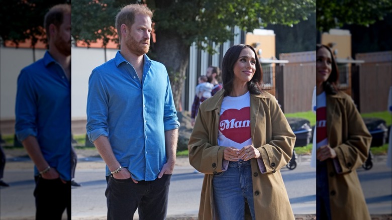 Prince Harry standing next to a smiling Meghan Markle