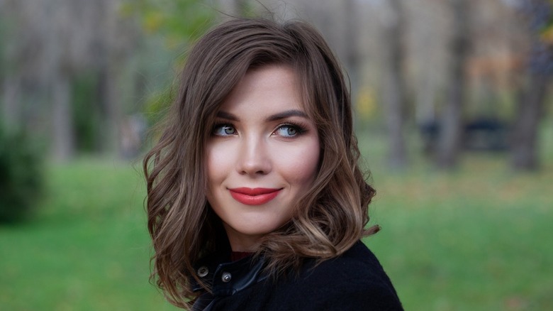 woman with long bob smiling