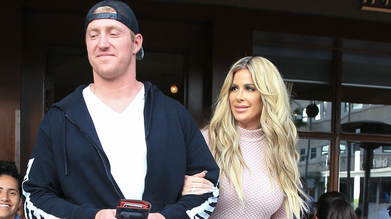 Kroy Biermann and Kim Zolciak walking