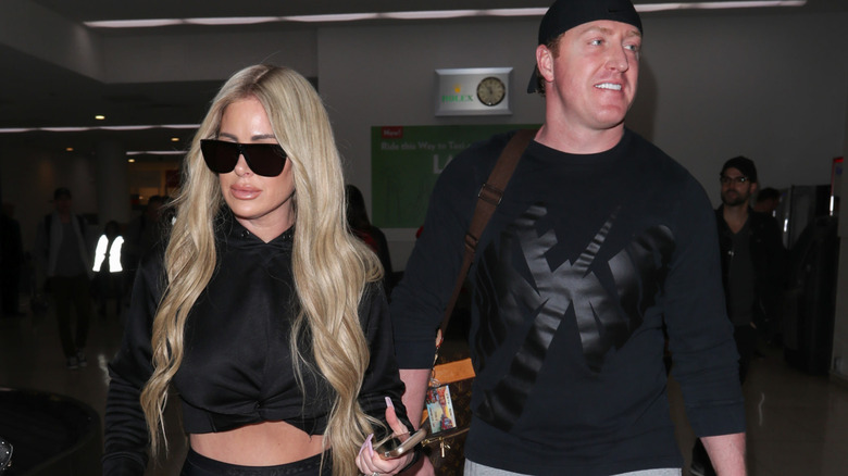 Kim Zolciak and Kroy Biermann walking