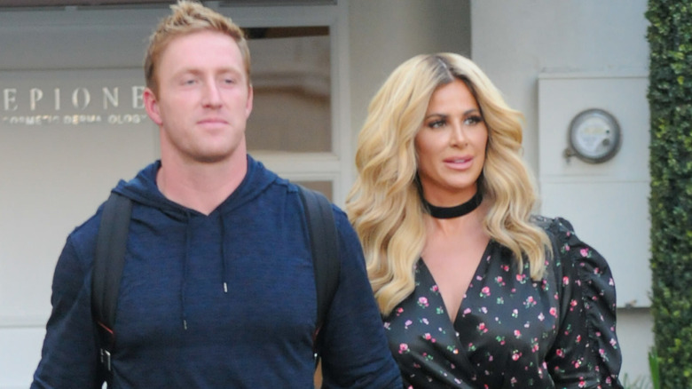 Kroy Biermann and Kim Zolciak walking