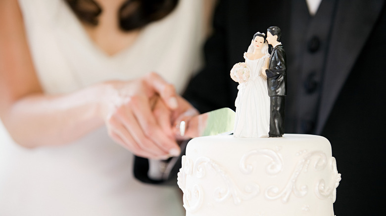 Wedding cake with bride and groom on top