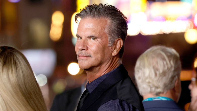 Lorenzo Lamas peeking over his shoulder