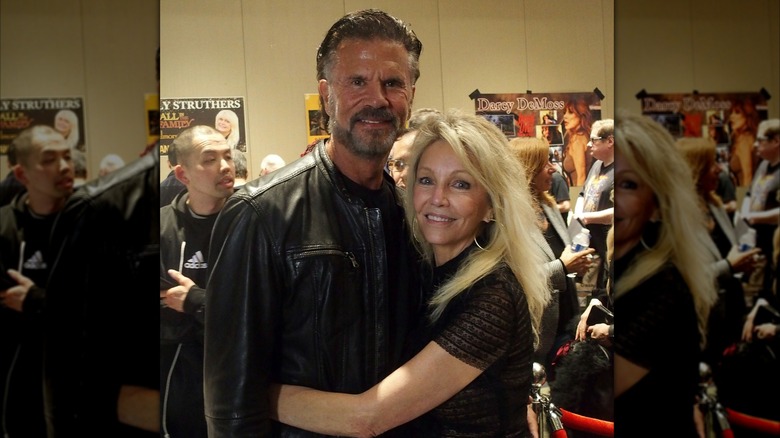 Lorenzo Lamas and Heather Locklear hugging and smiling