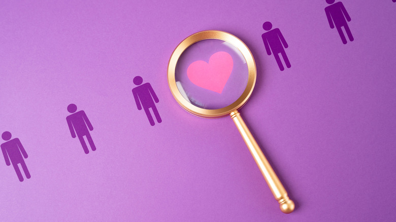 A magnifying glass over an illustration of a heart