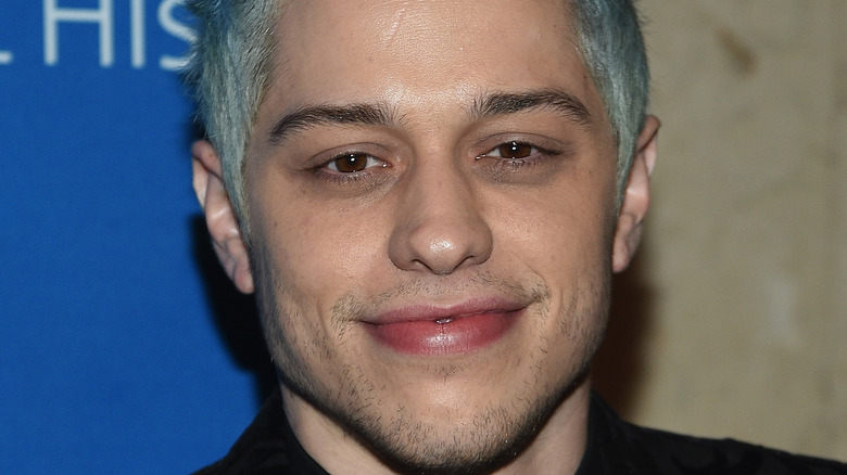 Pete Davidson smiling on the red carpet. 