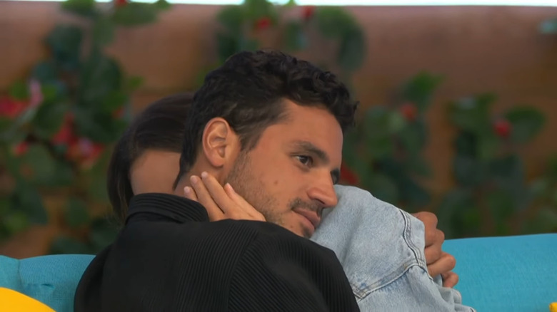 Felipe Gomes and Courtney Boerner embracing  