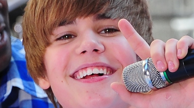Justin Bieber holding microphone