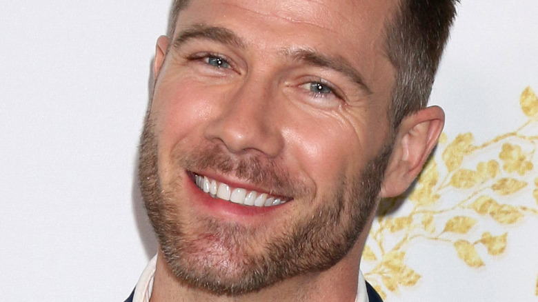 Luke Macfarlane smiling