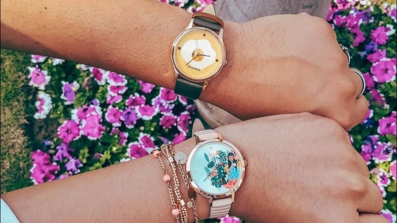 hands showing off watches