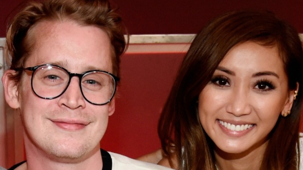 Macaulay Culkin and Brenda Song smiling