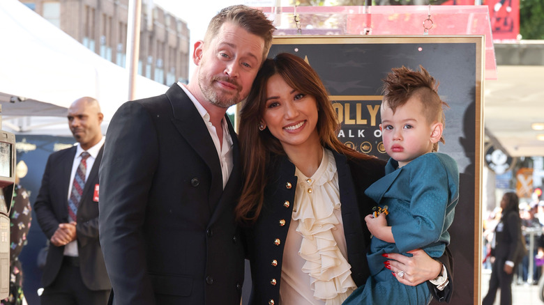 Macaulay Culkin, Brenda Song and Dakota Song Culkin attend the ceremony honoring Macaulay Culkin with a Star on the Hollywood Walk of Fame on December 01, 2023 in Hollywood, California.