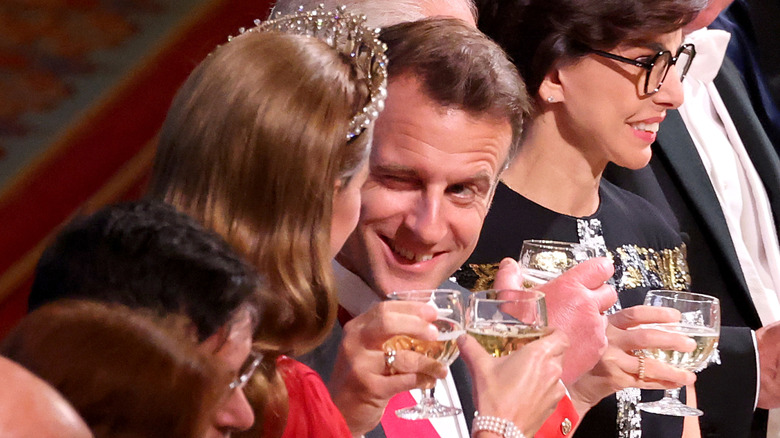 French President Emmanuel Macron winks at Catherine, Princess of Wales, during the State Banquet at Windsor Castle, July 8, 2025