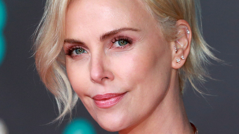 Charlize Theron poses on the red carpet