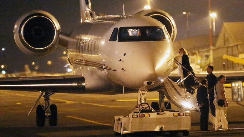 Madonna boarding a private plane