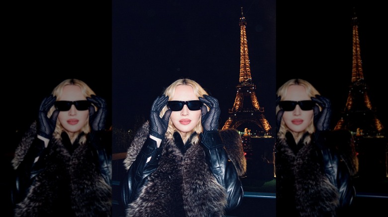 Madonna posing in front of the Eiffel Tower