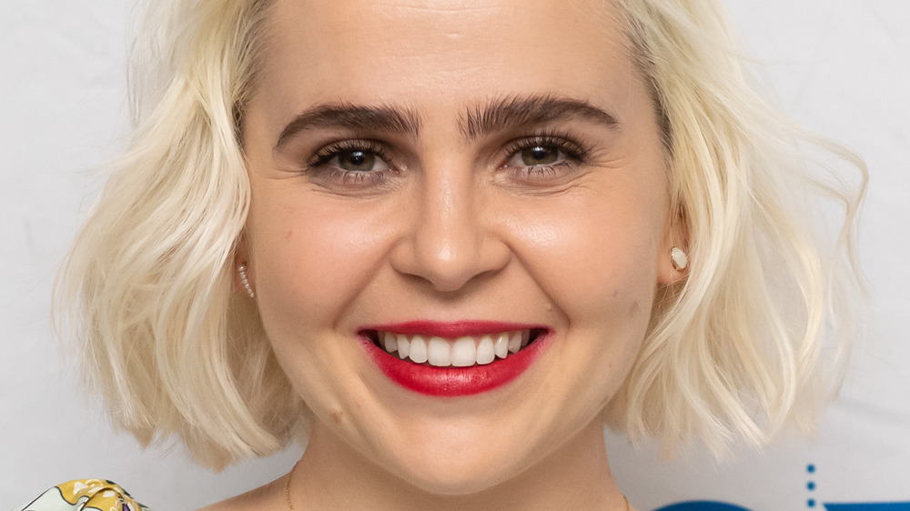 Mae Whitman poses at event