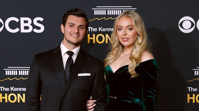 Michael Boulos wearing a black suit and tie and Tiffany Trump wearing a green velvet dress at the Kennedy Center Honors