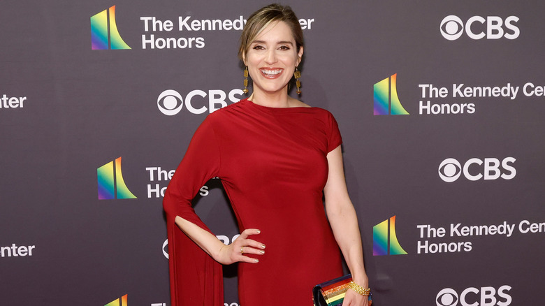 Margaret Brennan smiling in a red dress