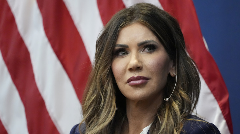 A closeup of Kristi Noem wearing hoop earrings while looking to the side