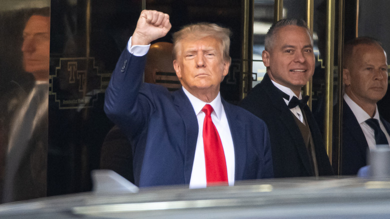 Former US President Donald Trump exits Trump Tower to attend court for his arraignment on April 04, 2023