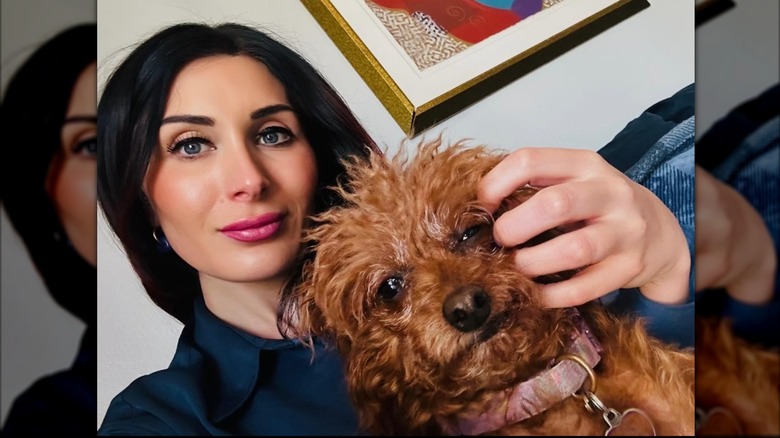 Laura Loomer poses with her dog in a photo shared to Instagram in November 2025.