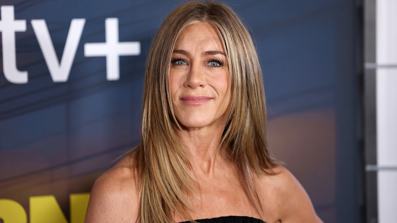 Jennifer Aniston in straight hair and off-shoulder dress