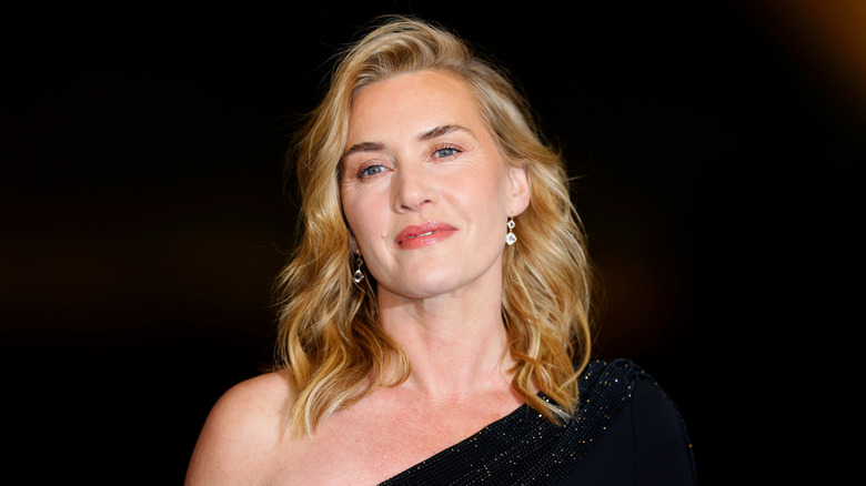 Kate Winslet in an embellished black one-shoulder dress