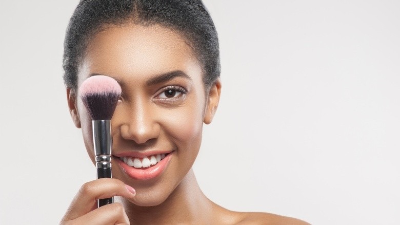 woman with makeup brush