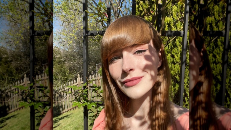 Peach makeup on strawberry blonde woman