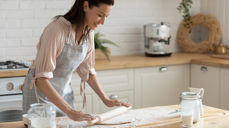 Woman rolling dough