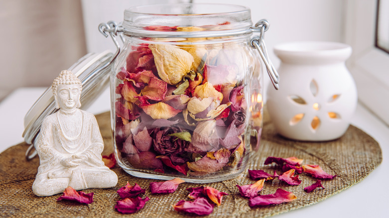potpourri next to Buddha statue