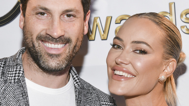 Maks Chmerkovskiy smiling with his wife Peta Murgatroyd