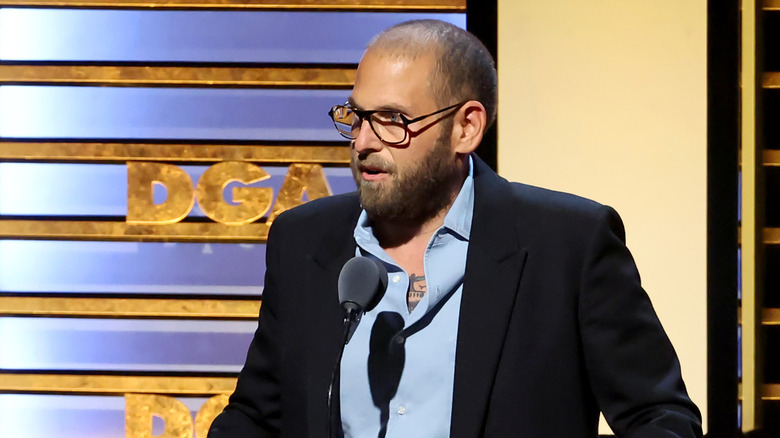 Jonah Hill speaking with shaved hair at a Directors Guild of America event