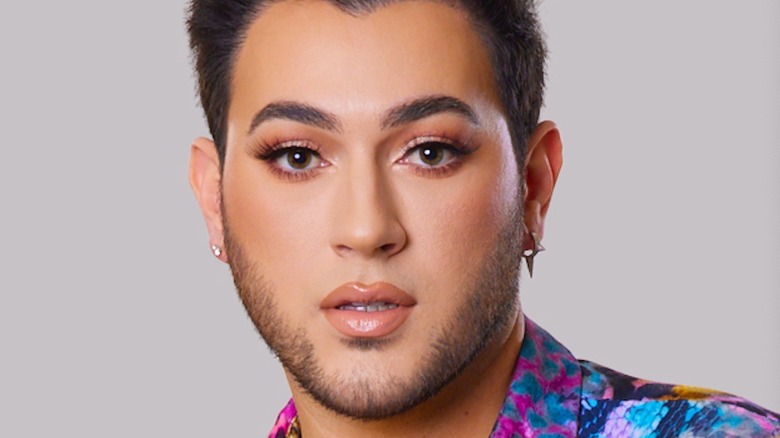 Manny MUA posing for headshot