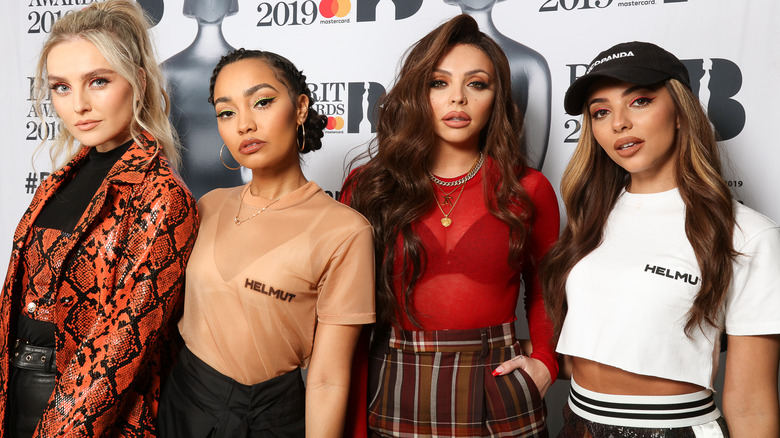 Little Mix posing at BRITs