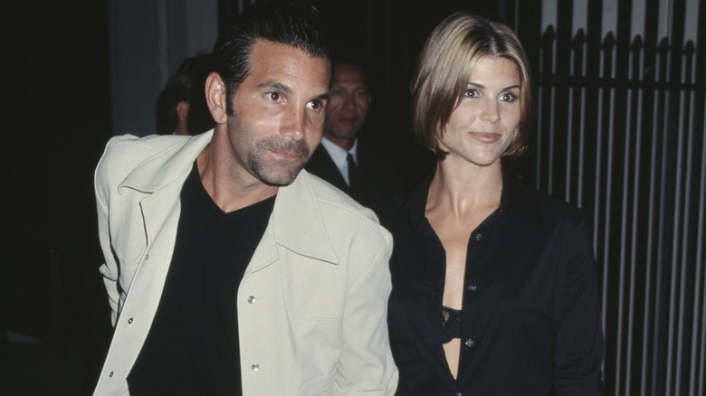 (l-r): Mossimo Giannulli and Lori Loughlin posing together at an event