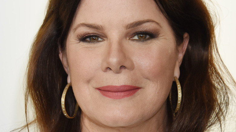 Marcia Gay Harden smiling on the red carpet