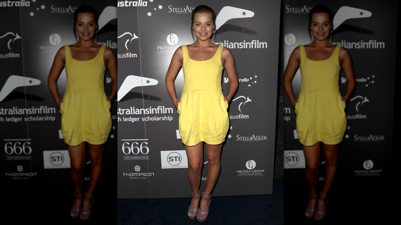 Margot Robbie in bright yellow dress