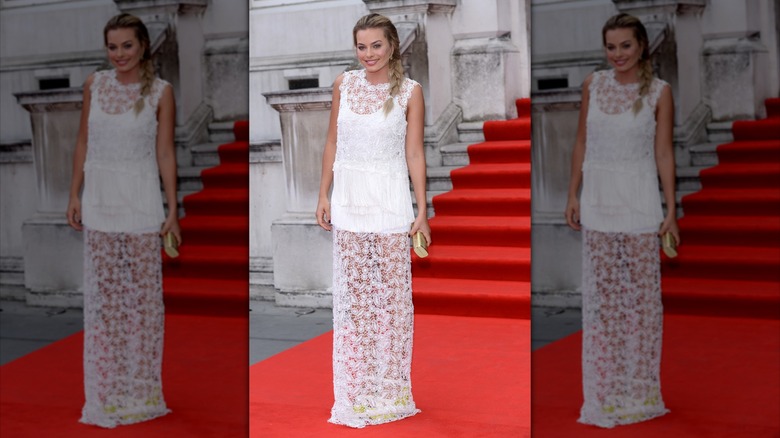 Margot Robbie in sheer top and white bodice