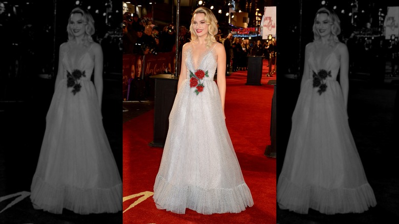 Margot Robbie at the European Premiere of "Mary Queen of Scots" 2018 wearing a silver dress with microdots and a red rose detail