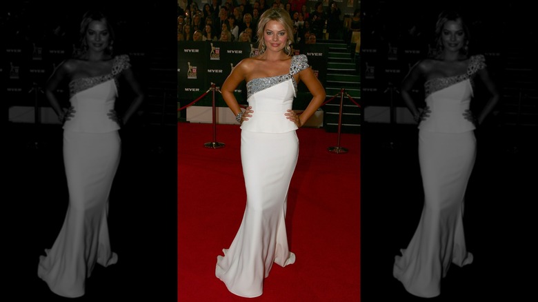 Margot Robbie at the TV Week Logie Awards in 2010 in Melbourne wearing a white floor-length gown with a silver one-shouldered top