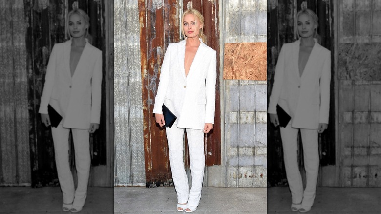 Margot Robbie at the Givenchy Spring 2016 fashion show in a white pantsuit