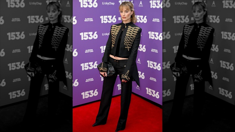 Margot Robbie at the "1536" West End opening night a black military-inspired jacket and matching trousers