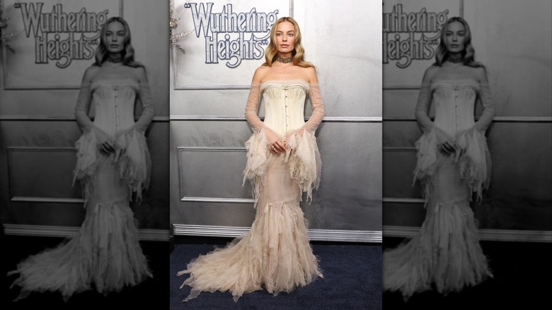 Margot Robbie at the "Wuthering Heights" Australian premiere wearing an off the shoulder, dramatic white feathered dress