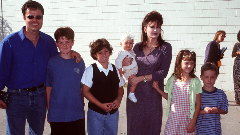 Donnie and Marie Osmond posing with their kids