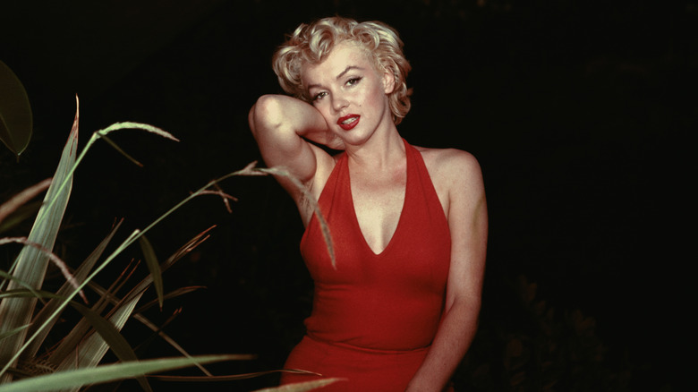 Marilyn Monroe posing in red