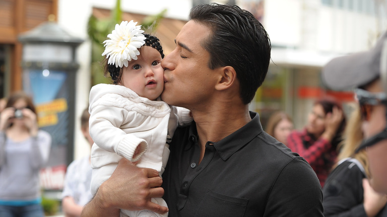 Mario Lopez kissing baby Gia
