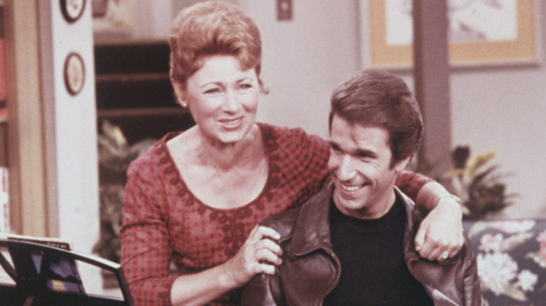 Marion Ross and Henry Winkler smiling and embracing in a still from 